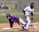 Lemoore's Andrew Mora slides safely into third base as Hanford's Dominik Perez looks for the loose ball.